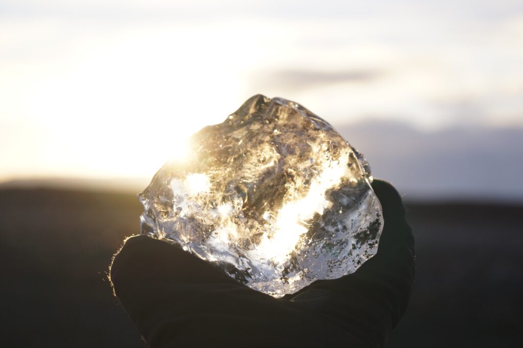 Clear crystal in front of water